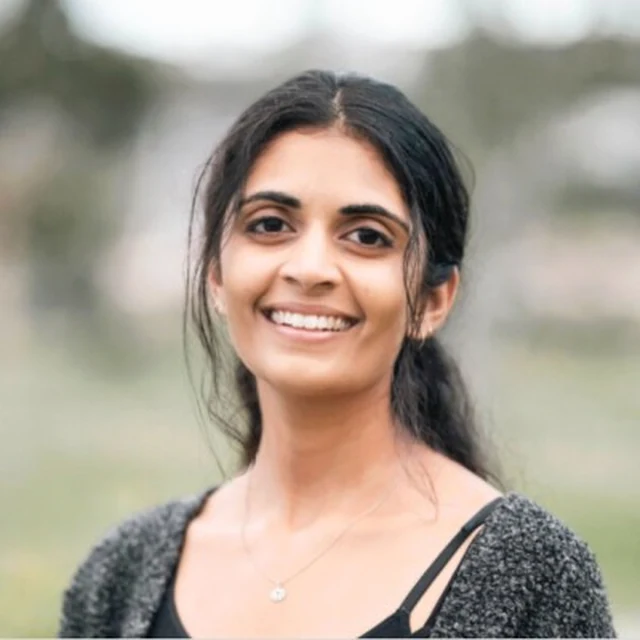 Nitya smiling outdoors